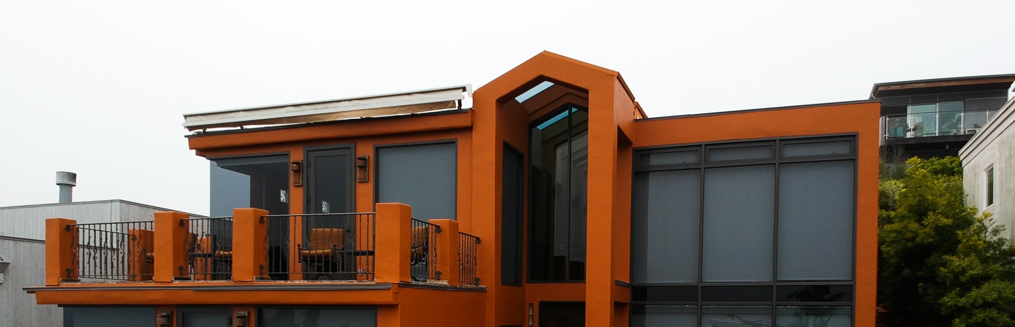 a wide image of a luxury house with orange painted walls